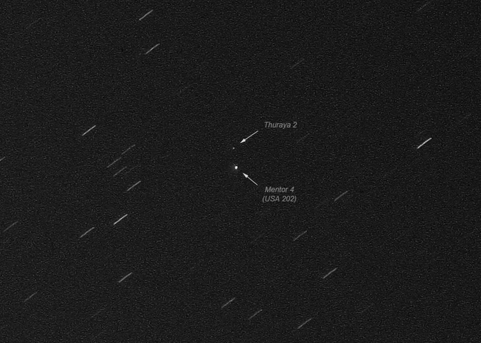 Geostationary satellites Thuraya 2 and USA 202 (Mentor 4, an Orion class) on 8 Dec 2010. Orions appear as dots equal in brightness to a magnitude +8 “star.” Image credit: Marco Langbroek